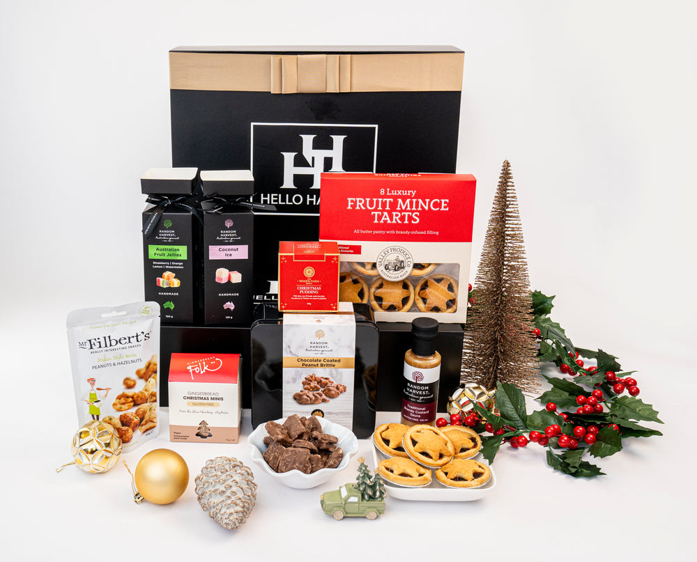Hello Hampers Christmas hamper with festive gourmet treats served in bowls beside the black HH gift box