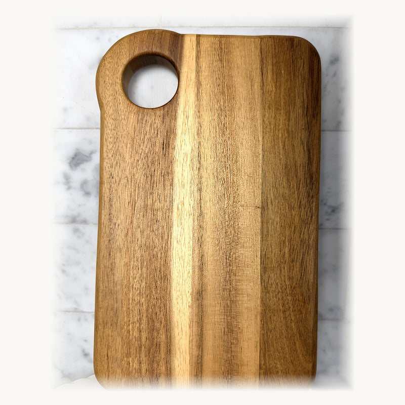 Natural timber serving board with circular handle opening